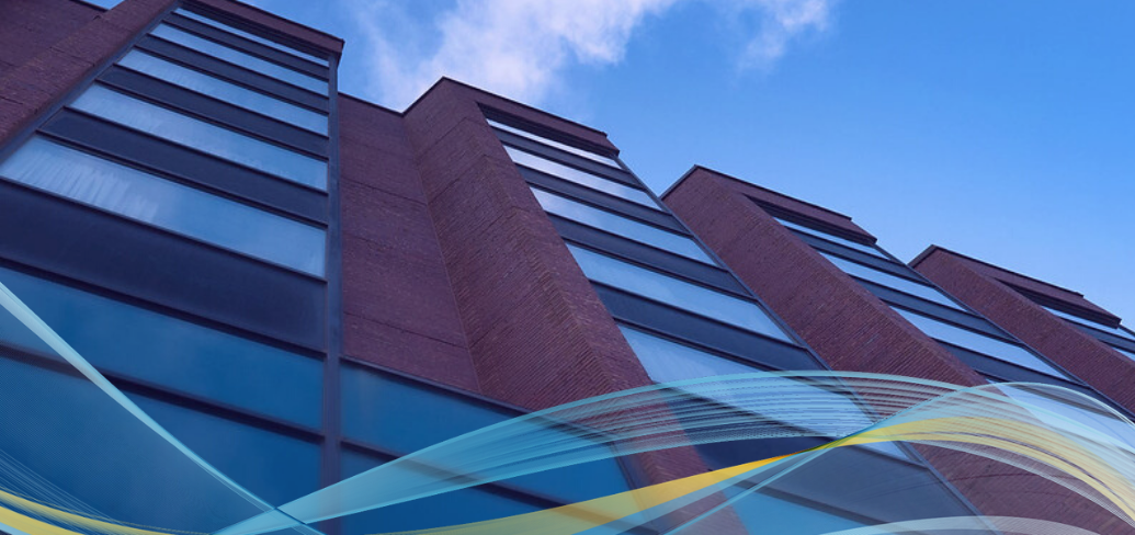 Image of glass and brick office building