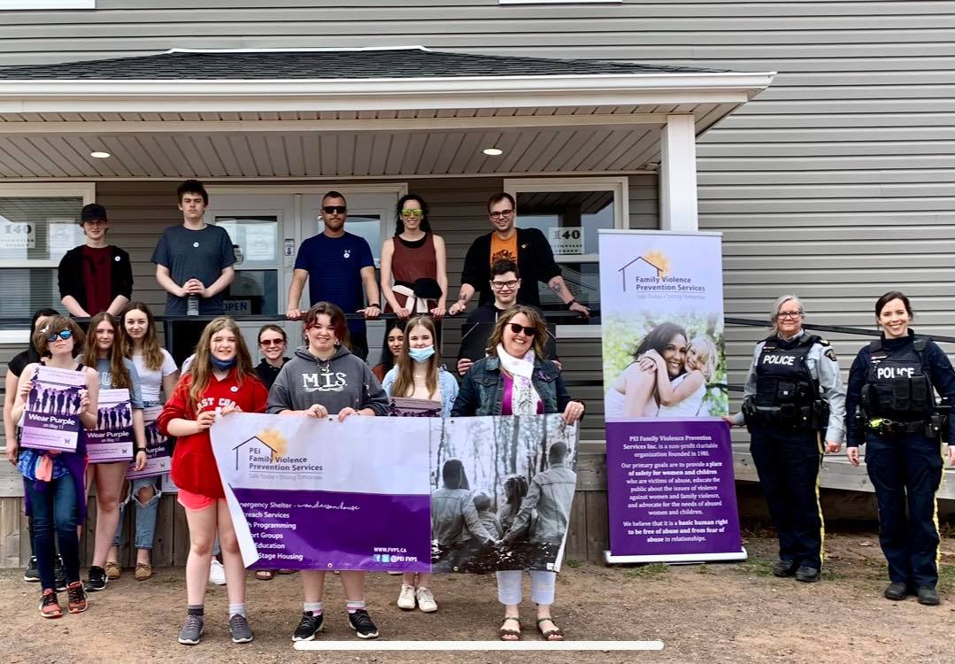 Family Violence Prevention Week- Walk in Silence (Montague) Participants holding Family Violence Prevention Services Banner. 