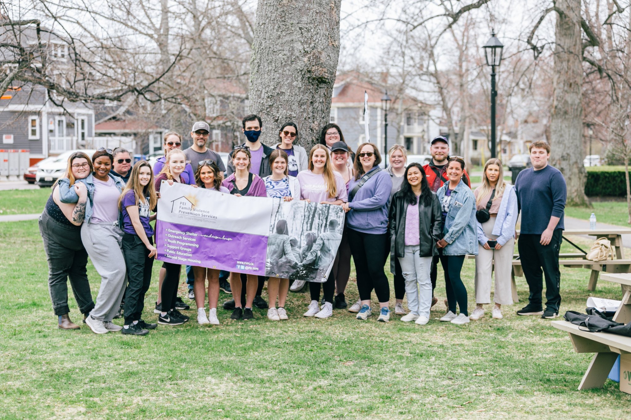 Family Violence Prevention Week- Walk in Silence (Charlottetown) Participants holding Family Violence Prevention Services Banner. 